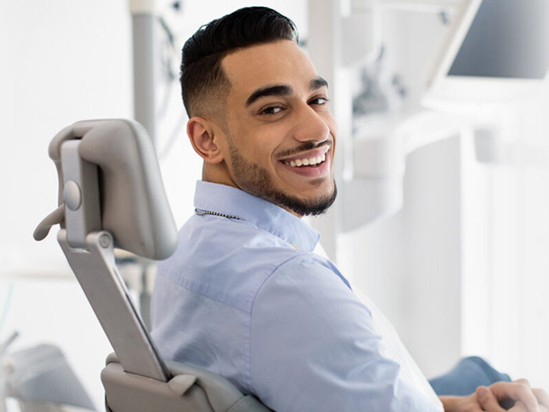 A person sitting on dental clinic