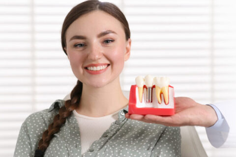 Happy women smiling after dental surgery